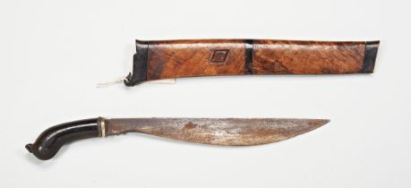 AN INDONESIAN KRIS, the blade of plain form with an exotic wood wrangka. 43 cms total length