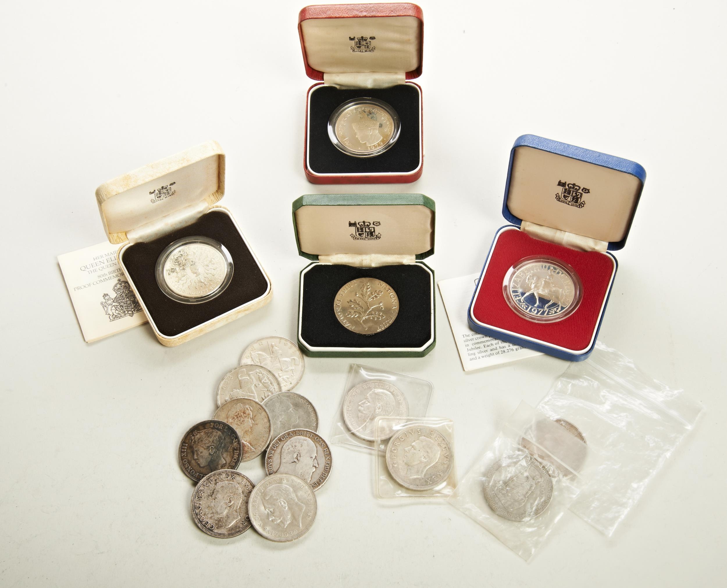 A 1977 PROOF SILVER JUBILEE CROWN, A QUEEN MOTHER 80TH BIRTHDAY PROOF CROWN, a Buthan proof coin,