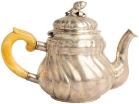 AN AUSTRO-HUNGARIAN TEAPOT C. 1840 With a spirally fluted body and cast acorn finial. 22 cm. 492 g.