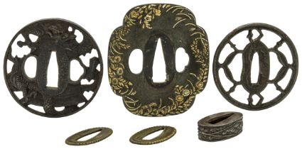 A JAPANESE BRONZE TSUBA decorated in takaniku zogan foliated and floral mixed metals on both