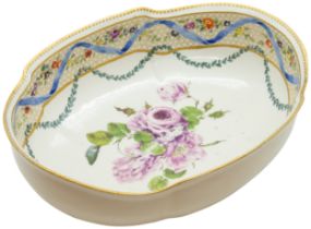 A MEISSEN BASIN CIRCA 1765 of lobed oval form, painted with floral spray within borders, 27cms wide.