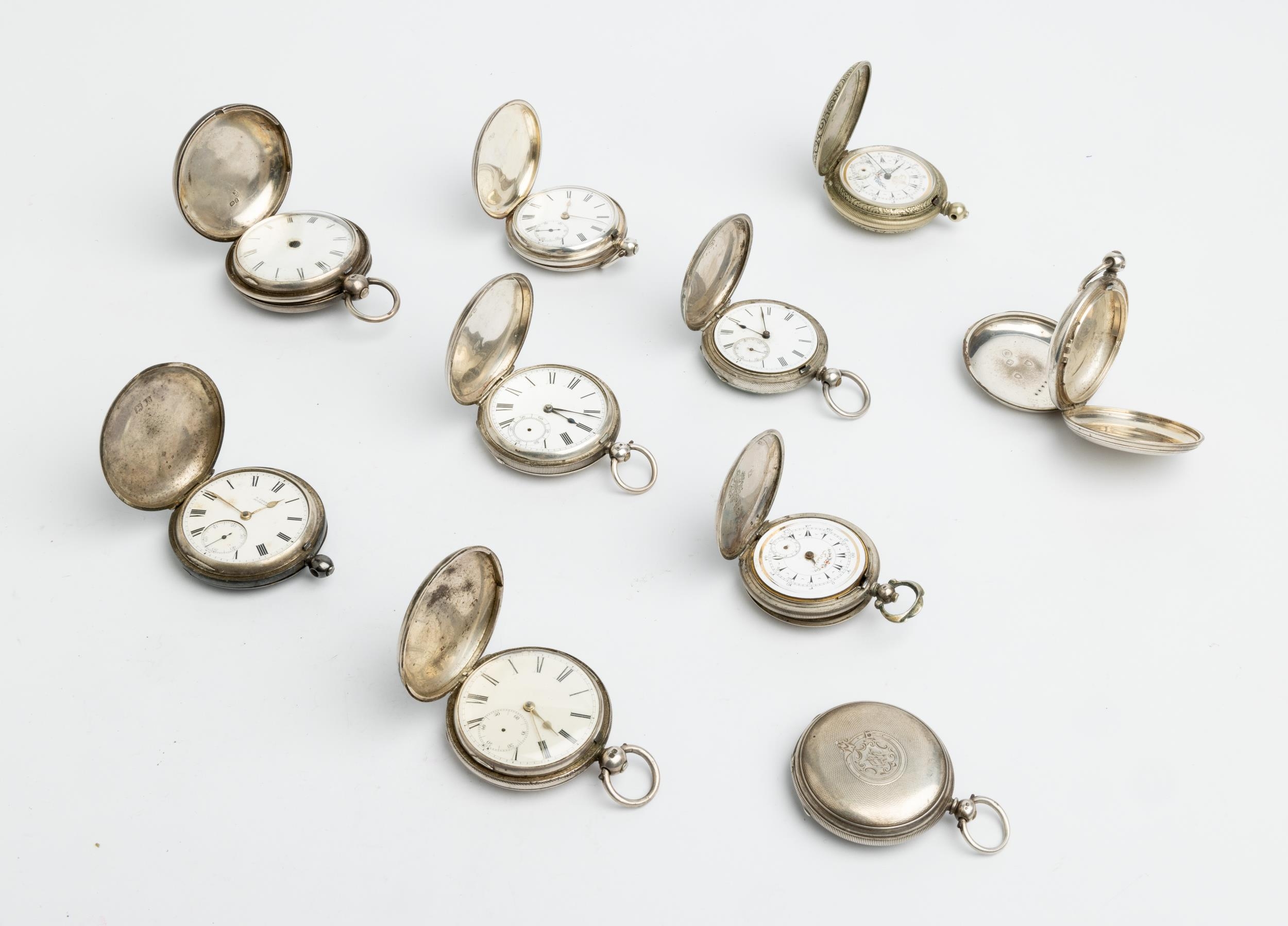 SEVEN HUNTING CASED ENGLISH SILVER WATCHES; a Swiss silver hunter with shooting and racing scenes;
