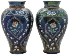 A PAIR OF IRIDESCENT GLASS AND ENAMELLED VASES 19th century, 21cms high