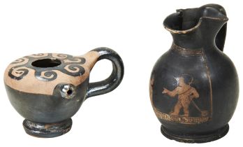A GREEK BLACK GLAZE FEEDER VASE CIRCA 400BC. With continuous scrolled painted decoration, and a