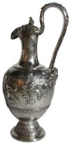 A large Victorian silver wine ewer. With classic Grecian chariot design amongst foliage & vines. (H: