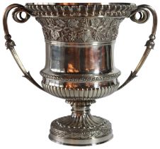 A large Victorian silver wine cooler, mark of C.F Hancock of London 1885. Campana form. Foot is