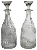 A pair of glass decanters with etched decoration & stoppers. (H: 33cm)