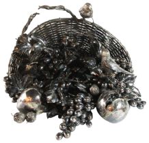 A large Italian silver basket centerpiece in the buccellati style overflowing with fruits & birds.