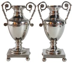 A pair of Grecian style two handled vases, German, (H: 25cm)