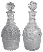 A pair of cut glass decanters & stoppers. (H: 28.5cm)