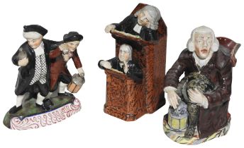 A 19TH CENTURY STAFFORDSHIRE GROUP 'THE VICAR & MOSES', modelled staggering with bottle, goblet