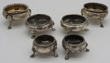 THREE PAIRS OF SILVER SALTS, the larger pair with gardrooned rims and hoof feet (marked Daniel &