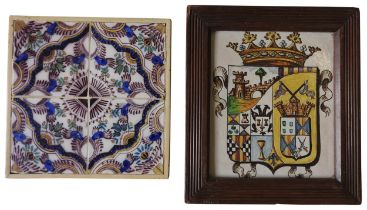 A LARGE ITALIAN ARMORIAL TILE MOUNTED ON A WOODEN FRAME AND A SET OF FOUR DELFT TILES MOUNTED IN A