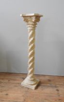 A DECORATIVE CORINTHIAN FORM PILLAR STAND, cast in resin with a rope twist laurel leaf column,