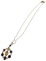 AN EDWARDIAN GEM SET YELLOW METAL PENDANT set with amethyst, quartz and garnet. Chain broken.