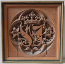 A 19TH CENTURY CARVED OAK QUATREFOIL PANEL, the interior carved with the initials S.J, surmounted by