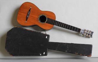 A 19TH CENTURY GUITAR WITH MOTHER OF PEARL INLAYS AND IN A WOODEN TRANSIT CASE. Neck detached, no