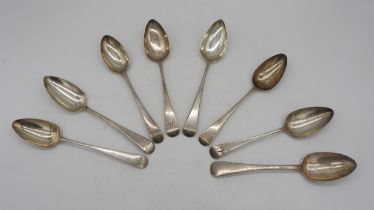 A MIXED GROUP OF GEORGIAN SILVER TABLE SPOONS, seven of the group carrying monograms, all bearing