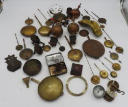 A QUANTITY OF CLOCK ITEMS. English and French pendulums, bells, finials etc. (qty) Provenance: