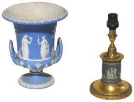 A WEDGWOOD JASPERWARE CAMPAGNA FORM URN AND JASPERWARE LAMP BASE, the tapered urn flanked by twin