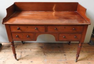 A VICTORIAN MAHOGANY WASH STAND, three quarter galleried rectangular top over two long and two short