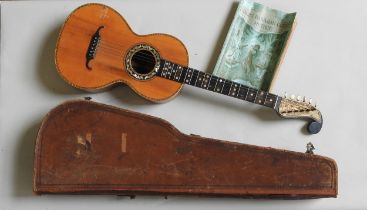 A 19TH CENTURY ROMANTIC ERA GUITAR inlaid with mother of pearl, the headstock With engraved brass ‘