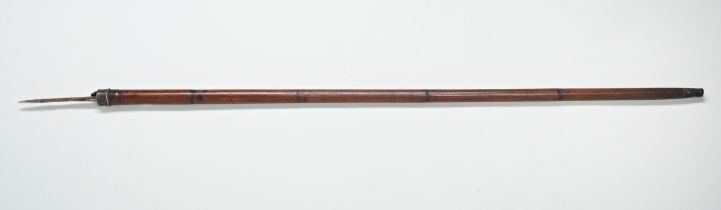 A 19TH CENTURY CANE the white metal top with a cap opening to reveal a ‘pig-sticker’ spike. 92cms