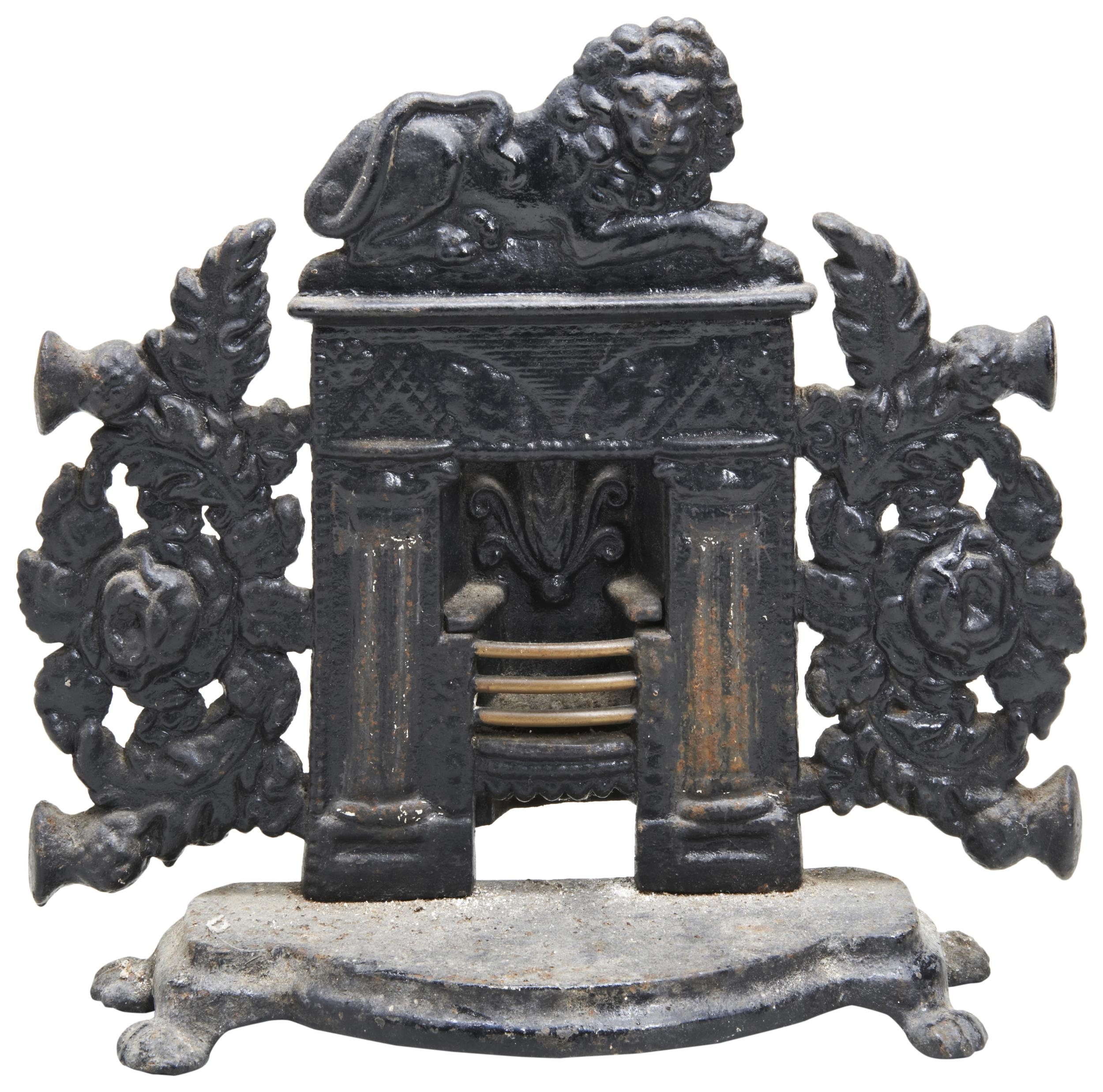 A VICTORIAN CAST IRON DOORSTOP IN THE FORM OF A FIREPLACE, THE GRATE WITH BRASS BARS. 32 x 33cms - Image 2 of 2