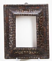 A CONTINENTAL 17TH CENTURY FRAME, the tortoiseshell veneer inlaid with metal floral decoration and a