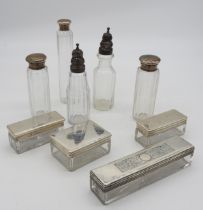 A GROUP OF SILVER MOUNTED TOILETTE BOXES AND TWO CRUET BOTTLES, one of the toilette boxes with a