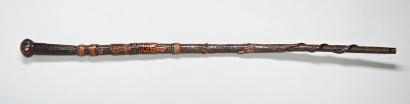 AN INTERESTING 'PRIMITIVE' WALKING STICK, carved with a representation of the American arms with a