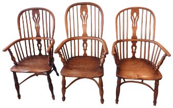 A GROUP OF THREE NEAR MATCHED EARLY 19TH CENTURY WINDSOR CHAIRS, all with pierced splats over elm