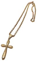 A 9CT GOLD CRUCIFIX PENDANT AND CHAIN, the crucifix with chased scroll work edges Chain 40 cm long