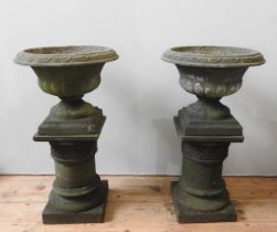 A PAIR OF GRECIAN STYLE GARDEN PLANTERS, 20TH CENTURY, the cast composite stone planters of fluted