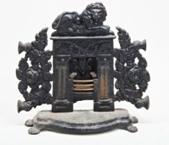 A VICTORIAN CAST IRON DOORSTOP IN THE FORM OF A FIREPLACE, THE GRATE WITH BRASS BARS. 32 x 33cms