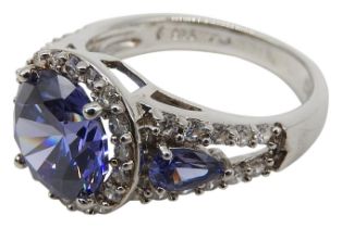 A SILVER COSTUME RING, set with cubic zerconia and blue stones, the shank stamped 925