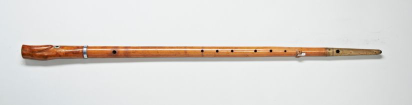 A RARE MUSICAL WALKING CANE fashioned as a woodwind instrument the shaft hollowed and punctuated