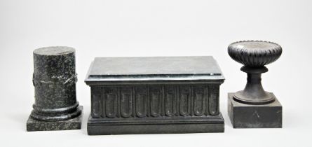 A LARGE RECTANGULAR FLUTED SERPENTINE PLINTH, a circular serpentine plinth, a turned slate and lobed