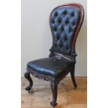 A VICTORIAN LEATHER UPHOLSTERED SPOON BACK NURSING CHAIR, CIRCA 1860, buttoned leather covered