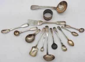 A MIXED GROUP OF SILVER WARE, the lot including a napkin ring, two sauce ladles, fork and a quantity