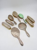 A GROUP OF TWO SILVER HAND MIRRORS AND SEVEN SILVER MOUNTED BRUSHES, various styles including an