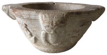 A MARBLE MORTAR, THE LUGS CARVED AS LIONS WITH RINGS OF WREATHS IN THEIR MOUTHS, and interspersed