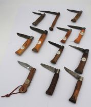 A MIXED GROUP OF TWELVE VINTAGE FRENCH FOLDING POCKET KNIVES, the lot includes five Opinel knives,