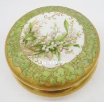 A LATE 19TH/EARLY 20TH CENTURY LIMOGES GILDED POT AND COVER, the cover hand painted with lily of the