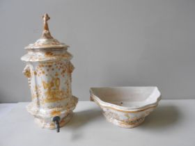 A FRENCH FAIENCE WALL CISTERN, 19TH CENTURY, cartouche form, the foliate painted lid surmounted by