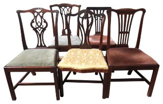 A GROUP OF FIVE 19TH CENTURY MAHOGANY DINING CHAIRS, in the Chippendale manner with ornate carved