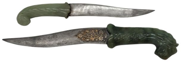 AN INDIAN STEEL DAGGER WITH NEPHRITE HORSES HEAD HANDLE AND ANOTHER WITH A CURVED HANDLE. 20th