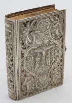 A SILVER MOUNTED VOLUME OF 'THE FOLLOWING OF CHRIST', LATE 19TH CENTURY, the front and back covers