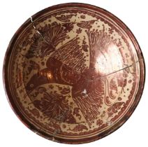 A HISPANO MORESQUE CHARGER/BASIN DECORATED IN COPPER LUSTRE WITH AN EAGLE, 17TH/18TH CENTURY, broken