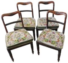A SET OF FOUR 19TH CENTURY MAHOGANY CHAIRS, foliate and stiff leaf carved top rail above a beaded